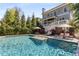 Beautiful backyard pool area, complete with lounging chairs and lush landscaping creating a private outdoor oasis at 2033 Lee Se Rd, Smyrna, GA 30080