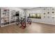 Recreation room featuring built-in shelving, a wall of windows, and an exercise area at 2033 Lee Se Rd, Smyrna, GA 30080