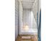 Outdoor shower featuring stone floor and light, surrounded by the siding of the home at 2033 Lee Se Rd, Smyrna, GA 30080