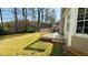 Side view of backyard showing a deck attached to a house with a large backyard at 3185 Haverhill Rowe, Lawrenceville, GA 30044