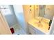 Bathroom with single vanity, mirror, cabinet, and window with an adjacent powder room at 3185 Haverhill Rowe, Lawrenceville, GA 30044