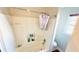 Bright bathroom featuring a shower-tub combo and a window letting in plenty of natural light at 3185 Haverhill Rowe, Lawrenceville, GA 30044