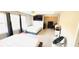 A bedroom with two beds, ceiling fan, baby chair, and great natural light, which offers a cozy retreat at 3185 Haverhill Rowe, Lawrenceville, GA 30044