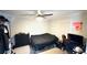 Functional bedroom with a bed, dresser, and desk setup, providing a comfortable space for rest and productivity at 3185 Haverhill Rowe, Lawrenceville, GA 30044