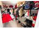 Walk-in closet with ample storage shelves, rods, and a variety of fashion accessories at 3185 Haverhill Rowe, Lawrenceville, GA 30044