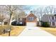 Charming two-story brick home with a two-car garage and well-manicured landscaping at 3185 Haverhill Rowe, Lawrenceville, GA 30044