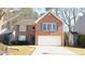 Charming two-story brick home with a two-car garage and well-manicured landscaping at 3185 Haverhill Rowe, Lawrenceville, GA 30044