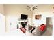 Cozy living room with a fireplace, ceiling fan, and neutral decor at 3185 Haverhill Rowe, Lawrenceville, GA 30044