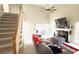Open concept living room with a staircase, fireplace and lots of natural light at 3185 Haverhill Rowe, Lawrenceville, GA 30044