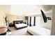 This main bedroom suite has two beds, a ceiling fan, and windows that provides abundant natural light at 3185 Haverhill Rowe, Lawrenceville, GA 30044