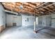 Unfinished basement area with concrete floor, exposed insulation, and visible utilities, offering potential for customization at 2072 Arbor Forest Sw Dr, Marietta, GA 30064