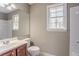 Bathroom featuring a single sink, vanity, a window, and combination tub/shower at 2072 Arbor Forest Sw Dr, Marietta, GA 30064