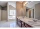 Bathroom featuring double sinks, a large mirror, and a shower/tub combination at 2072 Arbor Forest Sw Dr, Marietta, GA 30064