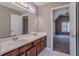 Bathroom featuring double sinks and a view to the bedroom at 2072 Arbor Forest Sw Dr, Marietta, GA 30064