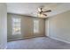 Bedroom with neutral paint, carpet floors, natural light from two windows and a ceiling fan at 2072 Arbor Forest Sw Dr, Marietta, GA 30064