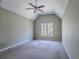 Spacious bedroom with vaulted ceiling, ceiling fan, and a large window at 2072 Arbor Forest Sw Dr, Marietta, GA 30064