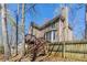 Home exterior featuring a wooden deck and wood siding, and fenced yard at 2072 Arbor Forest Sw Dr, Marietta, GA 30064