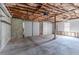 Unfinished garage with a concrete floor and insulated garage doors at 2072 Arbor Forest Sw Dr, Marietta, GA 30064