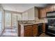 Cozy kitchen area with wood cabinets, stainless steel appliances, and a breakfast nook with large windows at 2072 Arbor Forest Sw Dr, Marietta, GA 30064