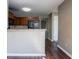 A kitchen with wooden cabinets, a breakfast bar, and hardwood floors at 2072 Arbor Forest Sw Dr, Marietta, GA 30064