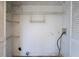 A small unfinished laundry room with shelving at 2072 Arbor Forest Sw Dr, Marietta, GA 30064