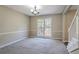 Bright living room featuring gray carpet, neutral paint, base molding and large window at 2072 Arbor Forest Sw Dr, Marietta, GA 30064
