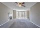 Bright living room with a fireplace, large bay window, and neutral carpet creating a cozy atmosphere at 2072 Arbor Forest Sw Dr, Marietta, GA 30064