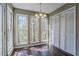 Sun-drenched breakfast room featuring hardwood floors, triple windows and access to a closet at 2072 Arbor Forest Sw Dr, Marietta, GA 30064