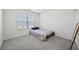 Bright bedroom featuring plush carpeting, a comfortable bed, and ample natural light at 469 Ralph Still Rd, Dacula, GA 30019