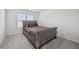 Bedroom featuring plush carpeting, a decorative bed, and ample natural light at 469 Ralph Still Rd, Dacula, GA 30019