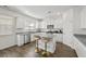 Bright kitchen with granite countertops, stainless steel appliances, and stylish seating at the island at 469 Ralph Still Rd, Dacula, GA 30019