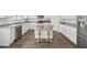 Bright kitchen with granite countertops, stainless steel appliances, and stylish seating at the island at 469 Ralph Still Rd, Dacula, GA 30019