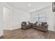 Cozy living room furnished with two comfortable sofas and a window offering natural light, creating a relaxing atmosphere at 469 Ralph Still Rd, Dacula, GA 30019