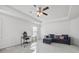 Bright open room featuring a ceiling fan, carpet, and ample natural light at 469 Ralph Still Rd, Dacula, GA 30019