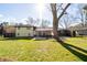 Backyard view of home with patio and grassy yard at 399 W Sandtown Sw Rd, Marietta, GA 30064