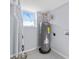 Basement utility room with water heater, essential for home maintenance and functionality at 399 W Sandtown Sw Rd, Marietta, GA 30064