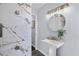 Modern bathroom featuring marble tiled walls and a vessel sink at 399 W Sandtown Sw Rd, Marietta, GA 30064