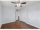 This light-blue bedroom offers hardwood floors, ceiling fan, and a spacious closet for ample storage at 399 W Sandtown Sw Rd, Marietta, GA 30064