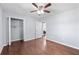 Spacious bedroom with a closet, ceiling fan, and hardwood flooring at 399 W Sandtown Sw Rd, Marietta, GA 30064