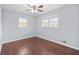 Bedroom featuring hardwood floors, natural light from the windows, and a ceiling fan at 399 W Sandtown Sw Rd, Marietta, GA 30064