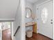 Bright foyer with a modern console table, decorative mirror, and view of the staircase leading to the upper level at 399 W Sandtown Sw Rd, Marietta, GA 30064