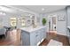 Bright kitchen with stainless appliances, an island with quartz countertop, and hardwood flooring at 399 W Sandtown Sw Rd, Marietta, GA 30064