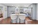 Beautiful kitchen boasts stainless steel appliances, marble backsplash, and a spacious island at 399 W Sandtown Sw Rd, Marietta, GA 30064