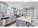 Updated kitchen with stainless steel appliances, sleek marble backsplash, and a stylish island at 399 W Sandtown Sw Rd, Marietta, GA 30064