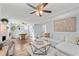 Open concept living room with sofa, dining table, and hardwood floors at 399 W Sandtown Sw Rd, Marietta, GA 30064