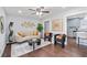 Stylish living room featuring modern furniture, art, a ceiling fan, and an open view of the kitchen at 399 W Sandtown Sw Rd, Marietta, GA 30064