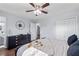 A serene main bedroom features a dresser, dark furniture, and ceiling fan for ultimate relaxation at 399 W Sandtown Sw Rd, Marietta, GA 30064