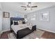 Comfortable main bedroom boasts a modern bed, stylish rug, and natural light from the windows at 399 W Sandtown Sw Rd, Marietta, GA 30064