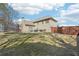A backyard with a well-maintained lawn, trampoline, privacy fence, and patio with furniture at 4020 Inman Park Lane, Buford, GA 30519