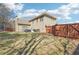 A sprawling backyard featuring a trampoline, wooden privacy fence, and a spacious lawn at 4020 Inman Park Lane, Buford, GA 30519